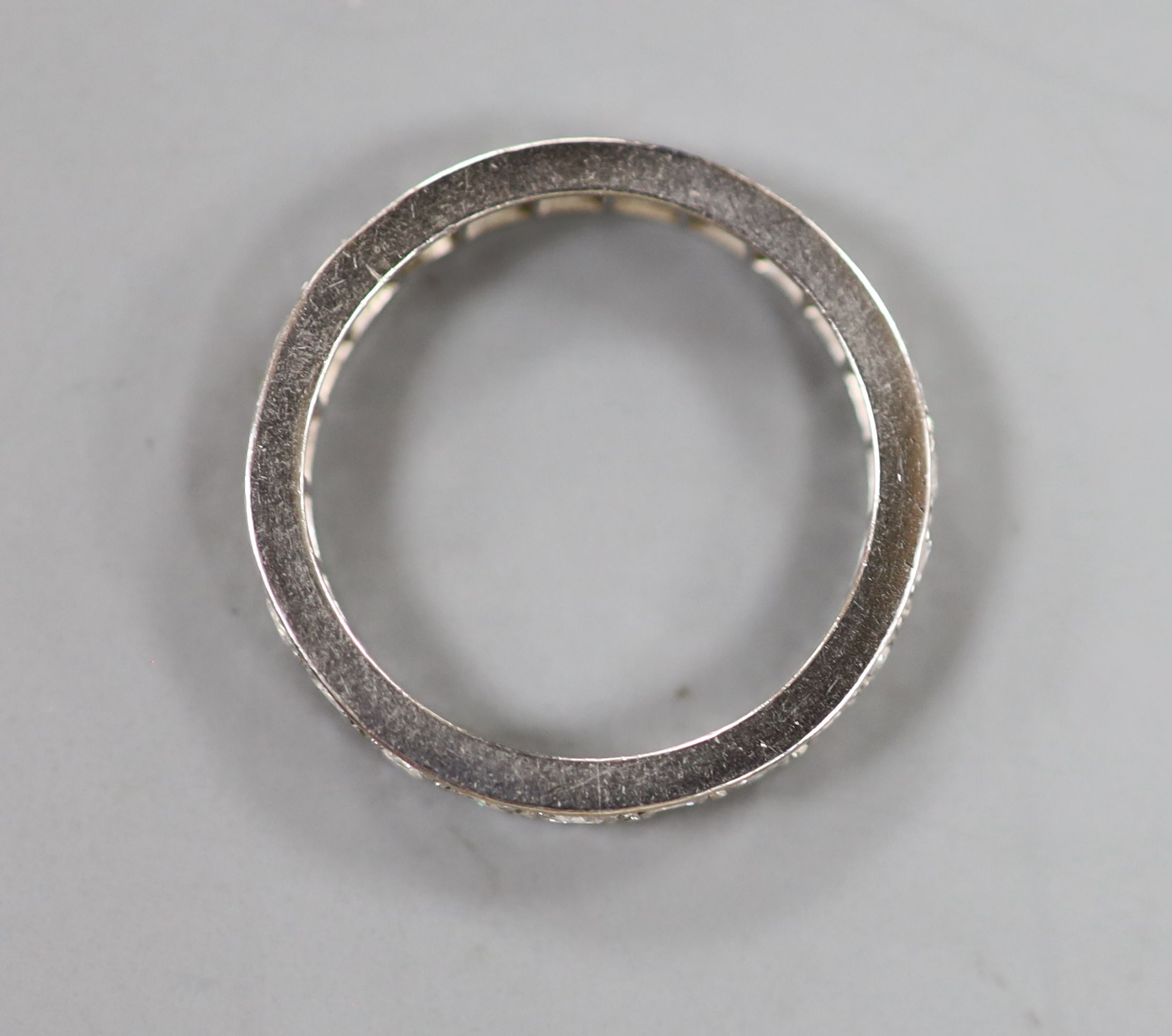 A white metal and diamond set full eternity ring